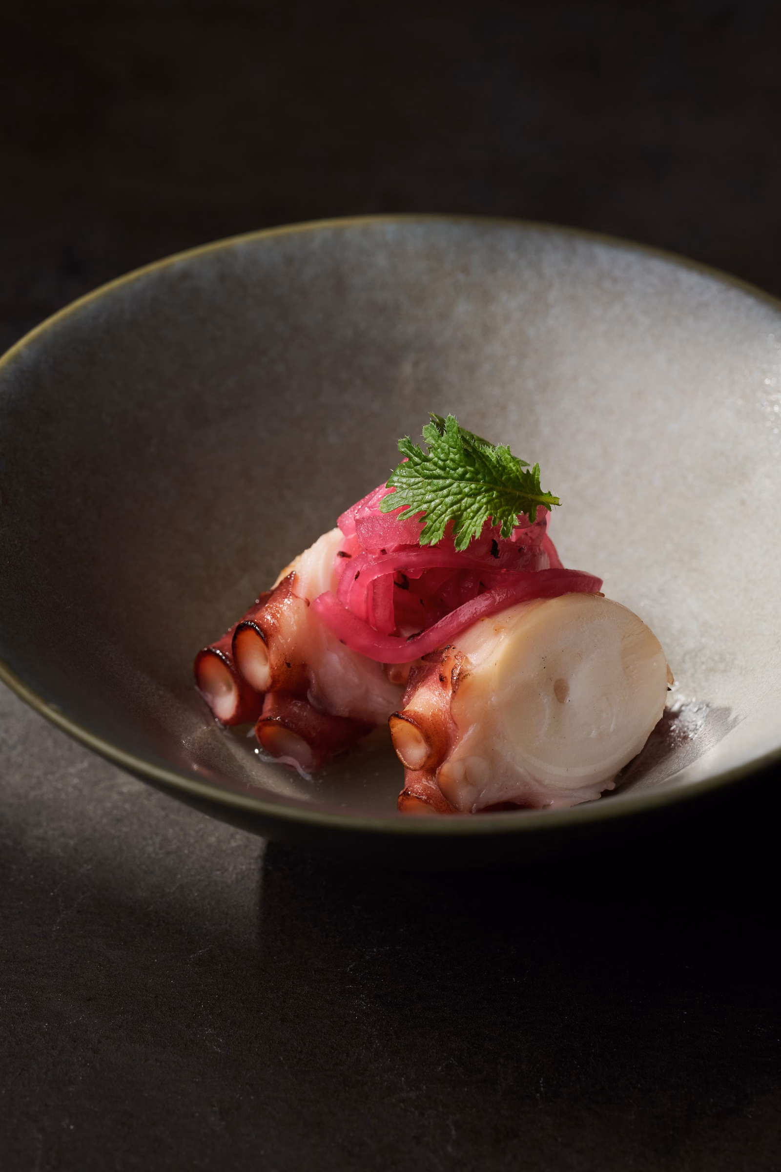 "Gently simmered octopus" paired with shiso and tangy pickled vegetables.
