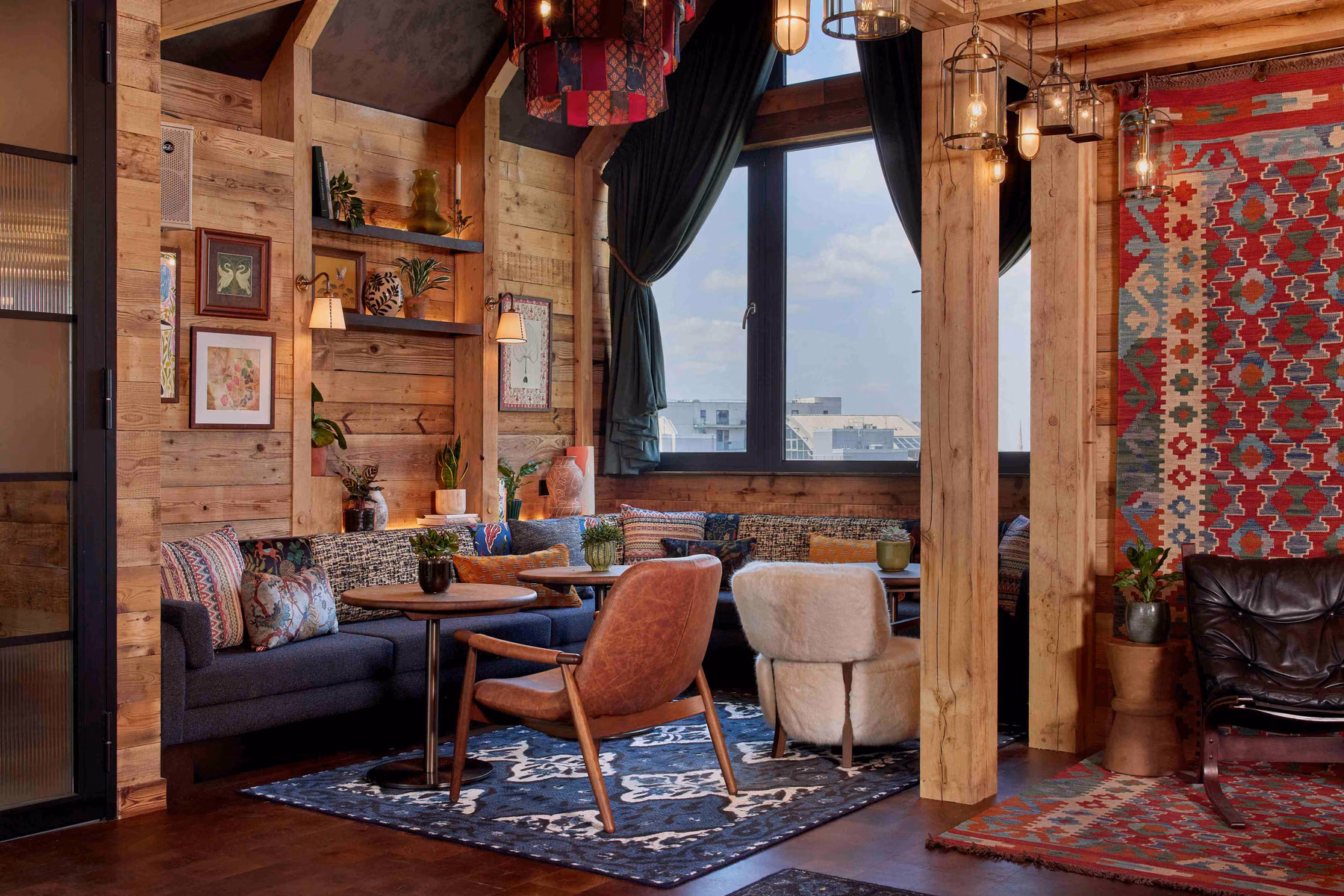 The Hideout responds to private gathering needs with timber-clad surfaces, soft seating, and corner spaces. Photo / Supplied by Treehouse Hotels