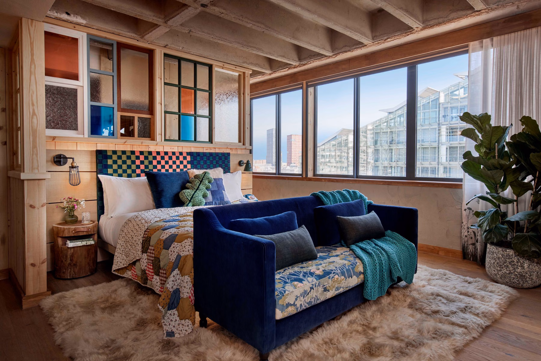 Suite photos provided by the hotel present a homely atmosphere through open window views, living room seating, and textile pairings. Photo / Supplied by Treehouse Hotels