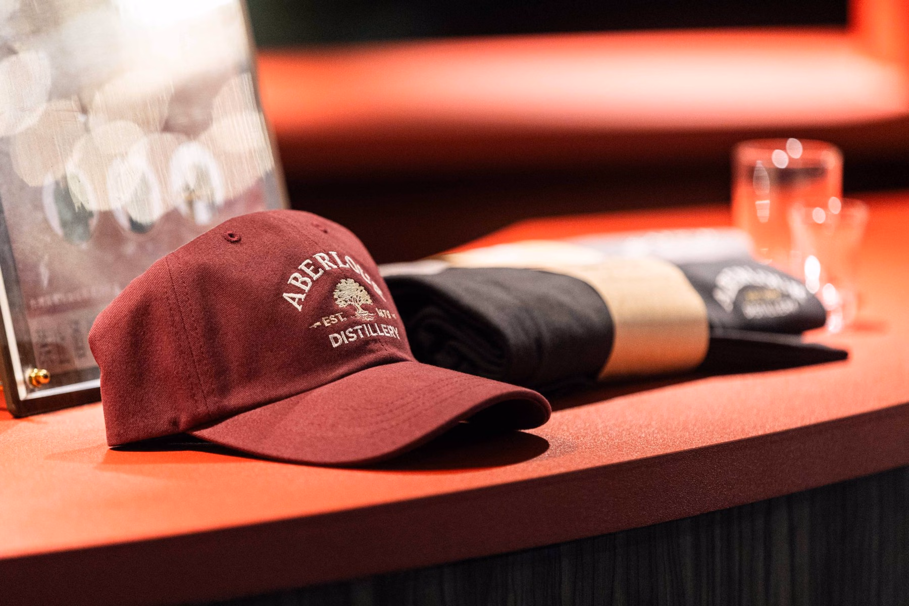 Display of event merchandise; on-site redemption and giveaways are subject to organizer rules and availability.