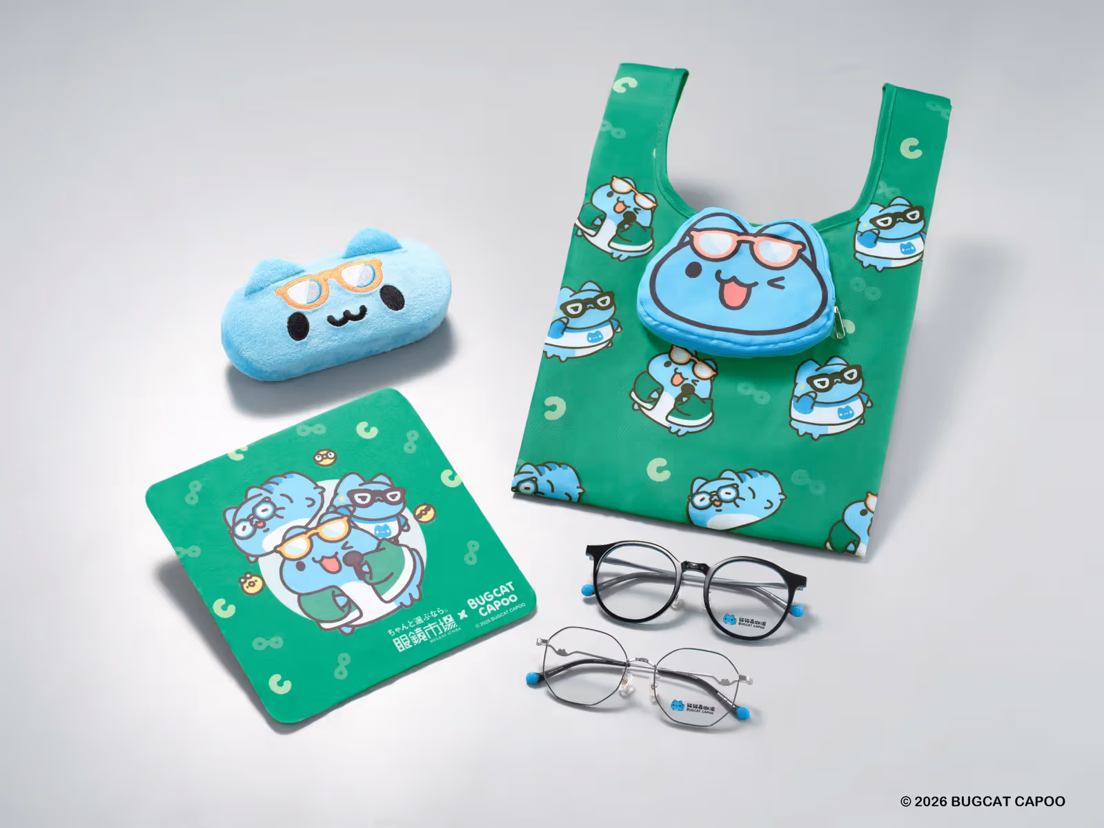 A Capoo glasses case, green cleaning cloth and bag beside two collaboration frames.