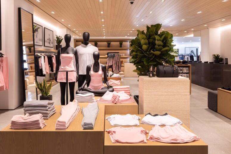 Light and pink clothing displays inside the store