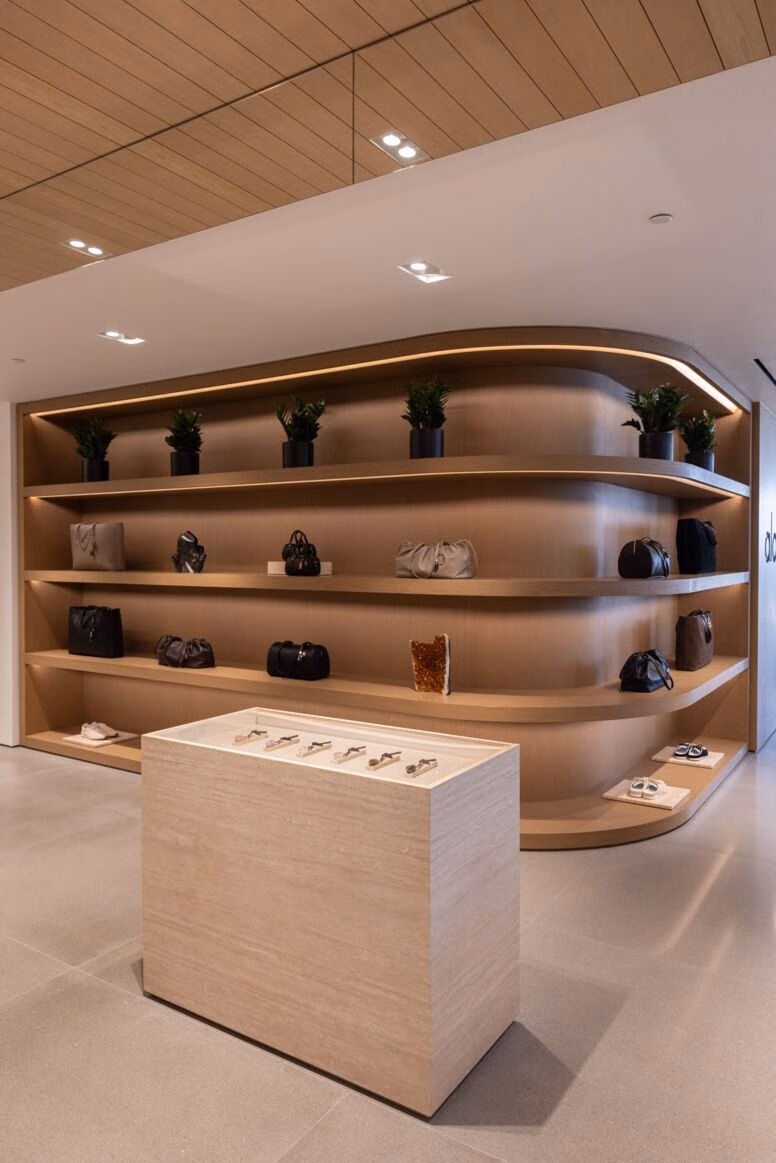Bags and accessories on wooden shelving