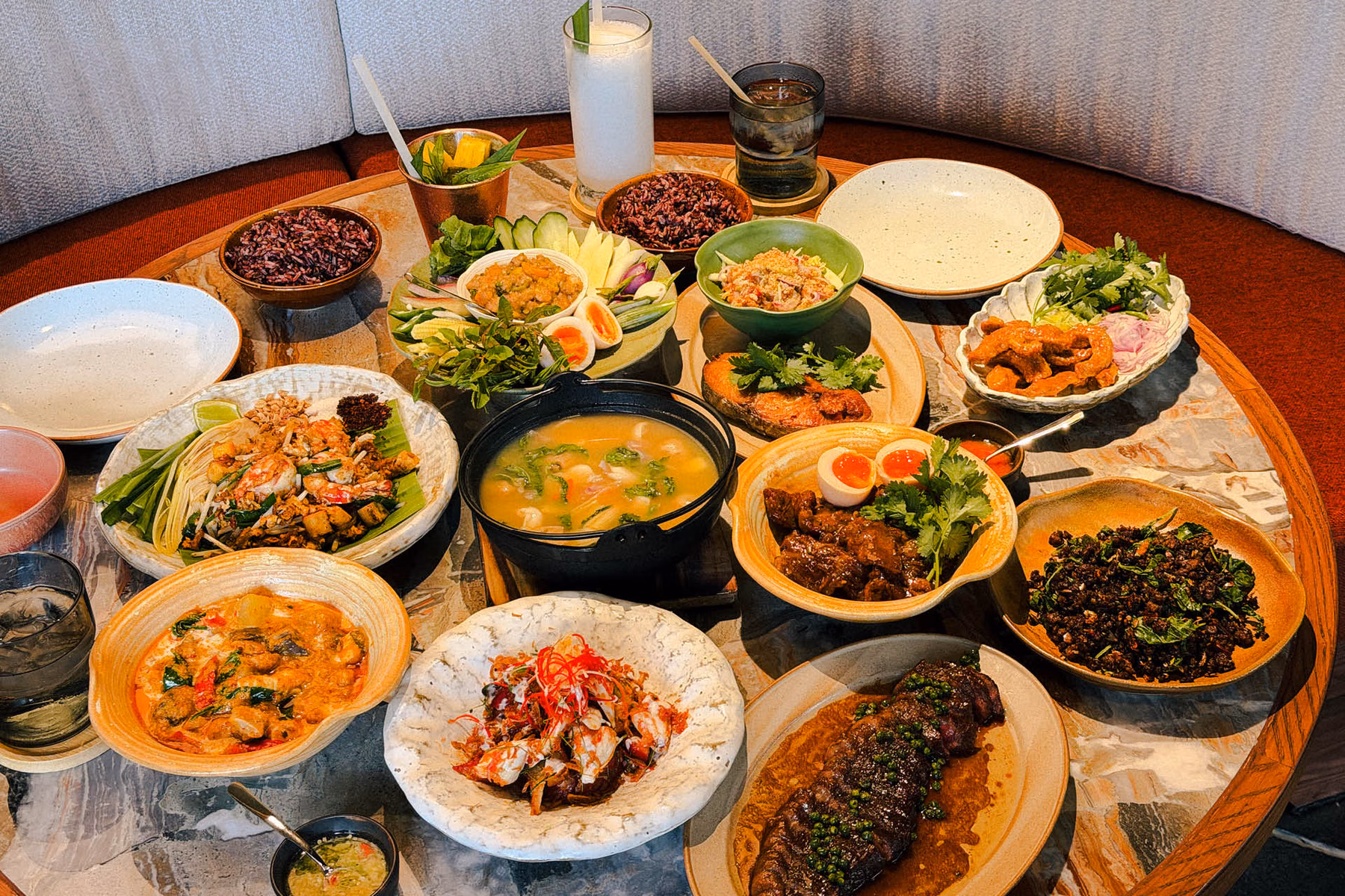 A spread of Thai dishes at BENJAMIN