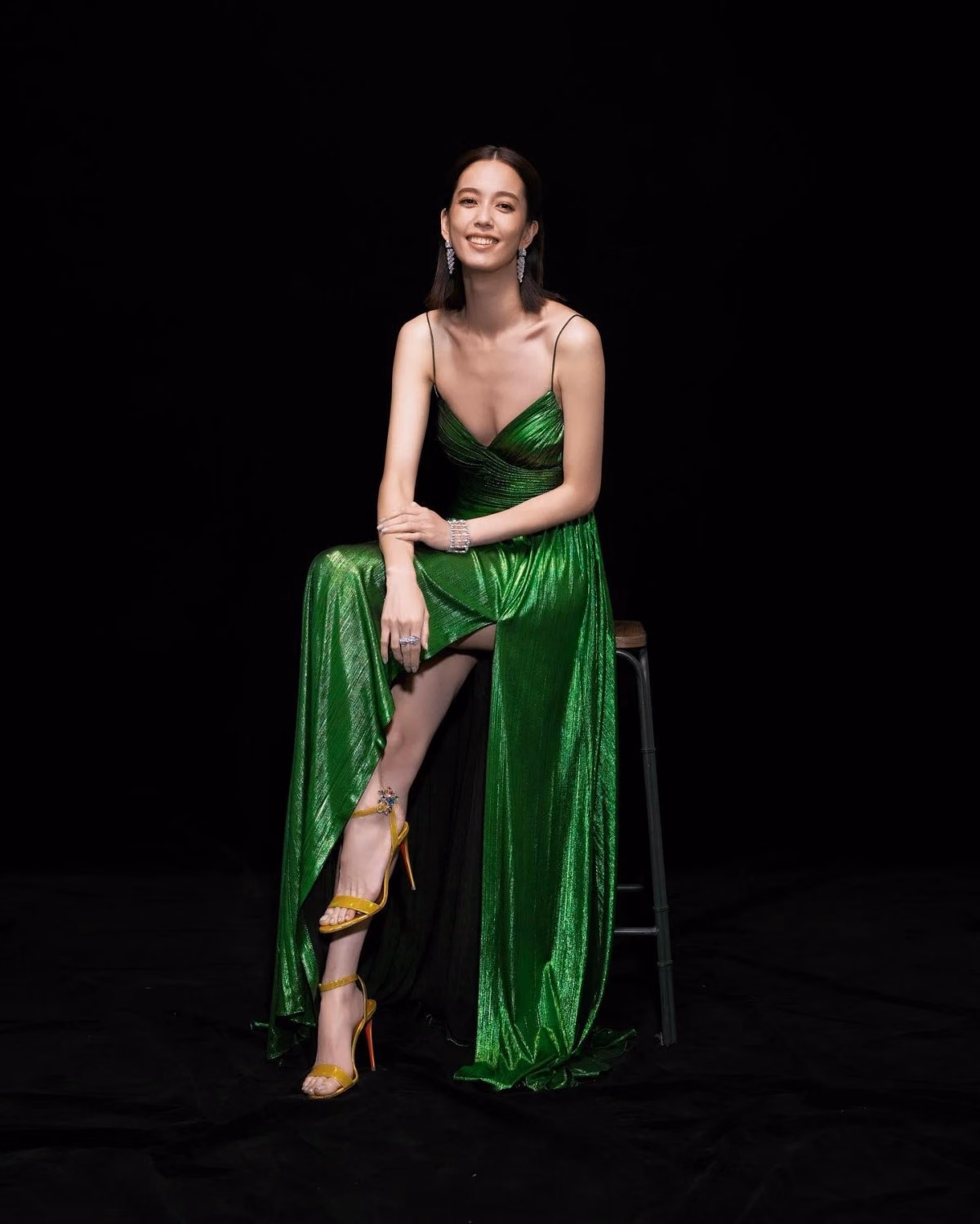 Annie Chen in bright green and yellow shoes