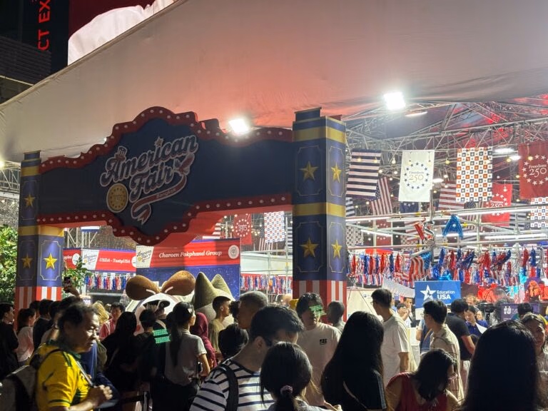 Decorations and visitors among the American Fair stalls