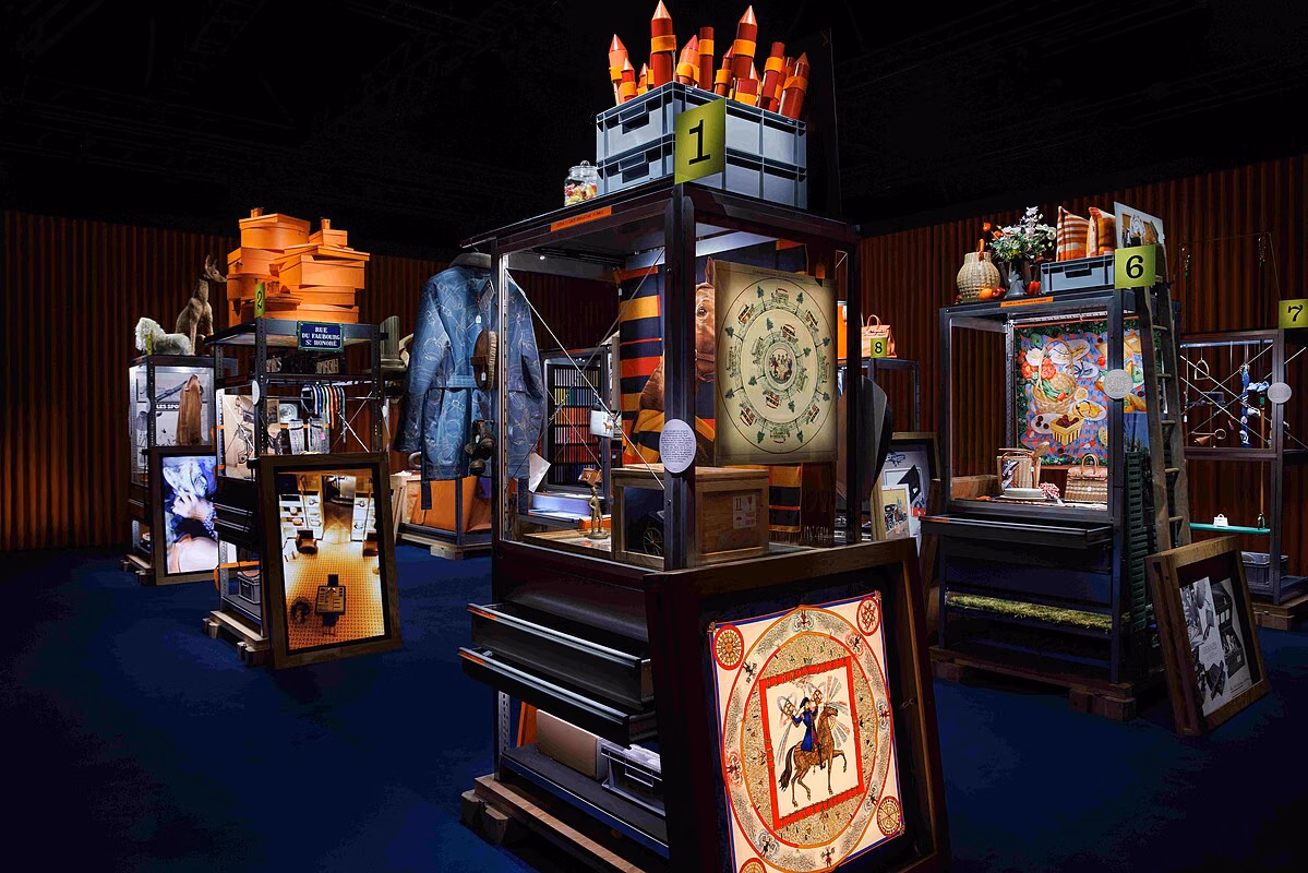 Display cabinets with scarves, clothing and orange boxes